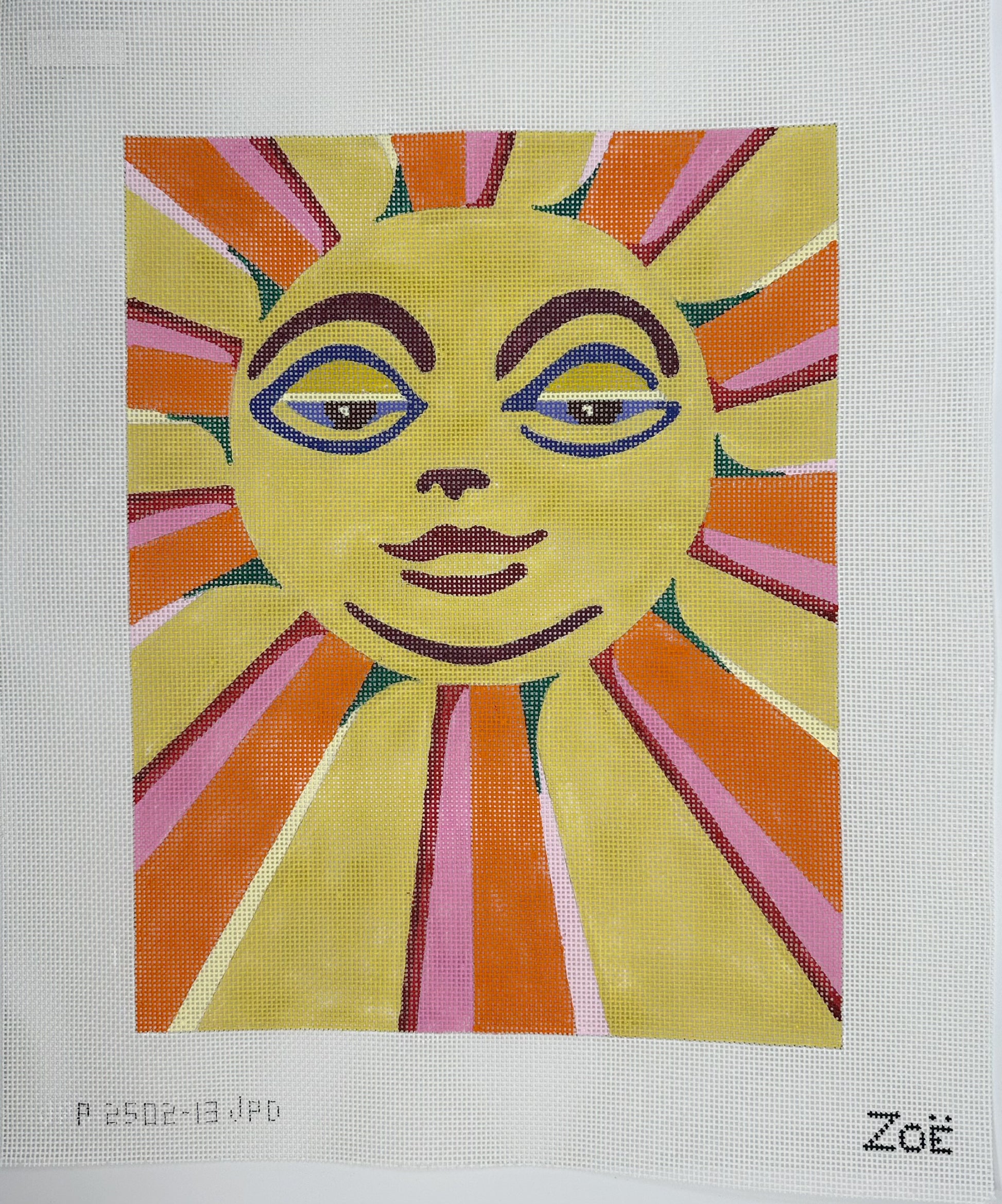 Colorful sun with face design on a white background, signed 'Zoé'.